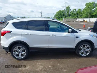 2019 Ford Escape Titanium with VIN 1FMCU9J98KUA95238, listed as a IAAI auction lot 42525324 with 59,222 mi miles and . Bid and sale history available at DreamBid. Image 13.