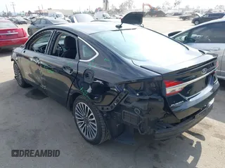 2018 Ford Fusion Titanium with VIN 3FA6P0RU6JR115236, listed as a IAAI auction lot 42111343 with 106,858 mi miles and . Bid and sale history available at DreamBid. Image 3.