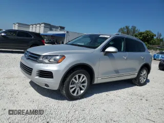 2014 Volkswagen Touareg Sport with VIN WVGEF9BP8ED005445, listed as a Copart auction lot 53694215 with 194,711 mi miles and Salvage Title. Bid and sale history available at DreamBid. Image 1.