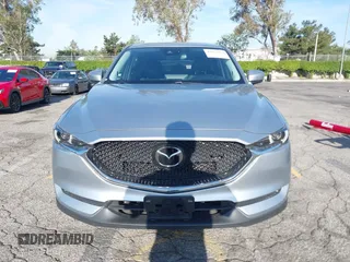 2021 Mazda CX-5 Grand Touring with VIN JM3KFADM1M1393251, listed as a IAAI auction lot 42072862 with 47,758 mi miles. Bid and sale history available at carsss.com. Image 12.