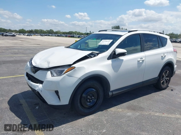2018 Toyota RAV4 XLE with VIN 2T3WFREV9JW490324, listed as a IAAI auction lot 42298261 with 167,727 mi miles and . Bid and sale history available at DreamBid. Image 2.