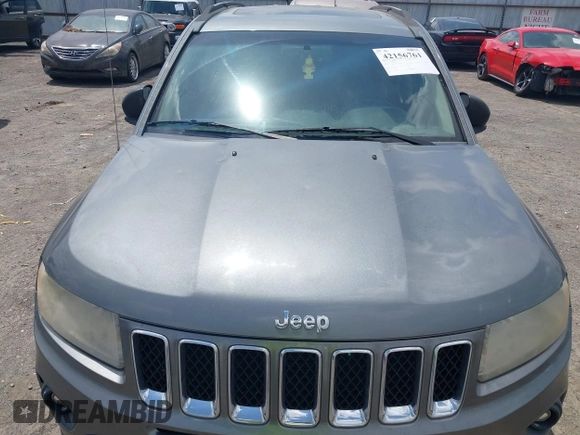 2011 Jeep Compass Latitude with VIN 1J4NT1FB4BD246549, listed as a IAAI auction lot 42156761 with 232,739 mi miles. Bid and sale history available at carsss.com. Image 6.