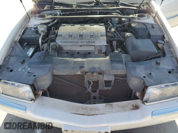 2000 Cadillac Eldorado z VIN 1G6EL12Y0YB702117, wystawiony jako Copart lot #80297854 z przebiegiem 124 851 mil mil oraz Szkoda całkowita • Salvage title. Historia ofert i sprzedaży dostępna na DreamBid. Obrazek 11.