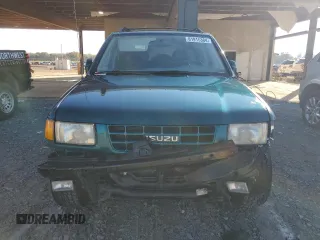 1999 Isuzu Rodeo S с VIN 4S2CK58W6X4352441, выставлен на аукционе Copart как лот 81915384 с пробегом 338 513 миль миль и На запчасти • Non repairable. История ставок и продаж доступна на DreamBid. Изображение 5.