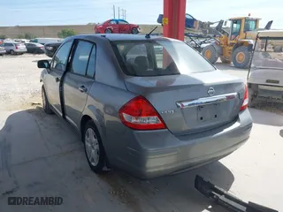 2010 Nissan Versa 1.8 S with VIN 3N1BC1AP0AL365397, listed as a IAAI auction lot 41987852 with 183,952 mi miles. Bid and sale history available at carsss.com. Image 3.