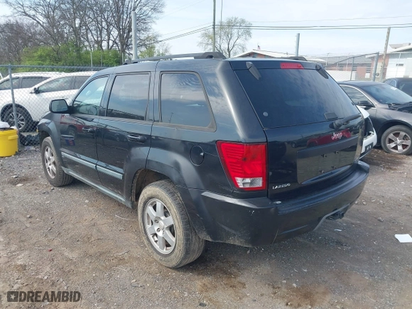 2009 Jeep Grand Cherokee Laredo with VIN 1J8GS48K59C548330, listed as a IAAI auction lot 41887548 with 184,434 mi miles. Bid and sale history available at carsss.com. Image 3.