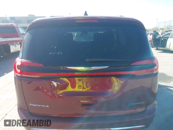 2021 Chrysler Pacifica Hybrid Touring L with VIN 2C4RC1L76MR581285, listed as a IAAI auction lot 42303222 with 77,808 mi miles and . Bid and sale history available at DreamBid. Image 16.