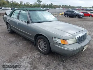 1999 Mercury Grand Marquis GS with VIN 2MEFM74W0XX725386, listed as a IAAI auction lot 41761461 with 143,896 mi miles. Bid and sale history available at carsss.com. Image 1.