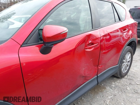 2016 Mazda CX-5 Touring z VIN JM3KE2CY3G0894441, wystawiony jako IAAI lot #41508767 z przebiegiem 88 554 mil mil oraz . Historia ofert i sprzedaży dostępna na DreamBid. Obrazek 6.
