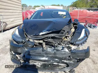2019 Tesla Model 3 Mid Range with VIN 5YJ3E1EA2KF306286, listed as a IAAI auction lot 41699127 with 56,249 mi miles and . Bid and sale history available at DreamBid. Image 12.