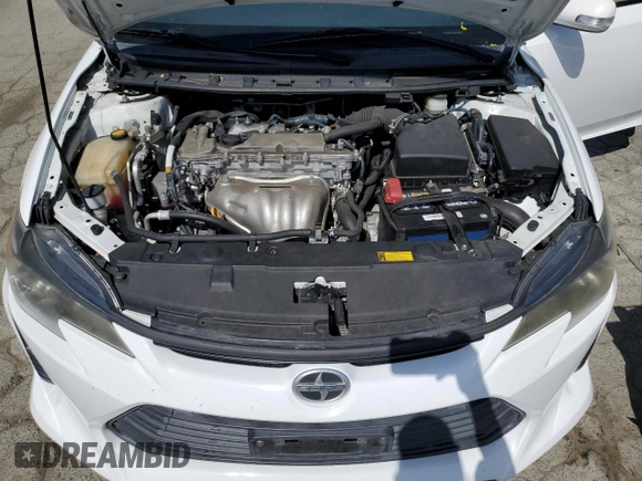 2014 Scion tC z VIN JTKJF5C71E3082375, wystawiony jako Copart lot #56909095 z przebiegiem 140 165 mil mil oraz Szkoda całkowita • Salvage title. Historia ofert i sprzedaży dostępna na DreamBid. Obrazek 11.