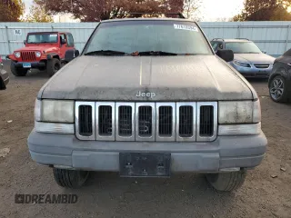 1997 Jeep Grand Cherokee Laredo with VIN 1J4GZ58S1VC741586, listed as a Copart auction lot 77619394 with 0 mi miles and Clean Title. Bid and sale history available at carsss.com. Image 5.