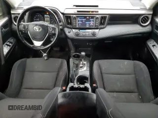 2018 Toyota RAV4 XLE with VIN JTMRFREV0JJ200337, listed as a Copart auction lot 84901594 with 57,301 mi miles and Salvage Title. Bid and sale history available at DreamBid. Image 8.