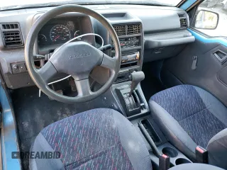 1995 Geo Tracker z VIN 2CNBE18U4S6948656, wystawiony jako Copart lot #76087194 z przebiegiem 163 080 mil mil oraz Szkody całkowita. Historia ofert i sprzedaży dostępna na DreamBid. Obrazek 8.