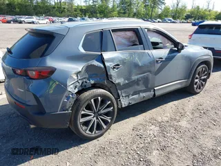 2023 Mazda CX-50 S Premium Plus with VIN 7MMVABEM8PN108020, listed as a IAAI auction lot 42203568 with 26,783 mi miles and . Bid and sale history available at DreamBid. Image 4.