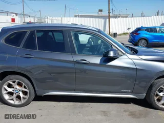 2014 BMW X1 xDrive28i with VIN WBAVL1C57EVY23722, listed as a IAAI auction lot 41839543 with 121,742 mi miles. Bid and sale history available at carsss.com. Image 14.