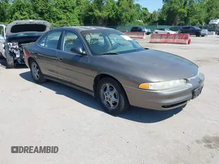 1999 Oldsmobile Intrigue GX z VIN 1G3WH52K5XF334949, wystawiony jako IAAI lot #42252647 z przebiegiem 80 705 mil mil oraz . Historia ofert i sprzedaży dostępna na DreamBid. Obrazek 1.
