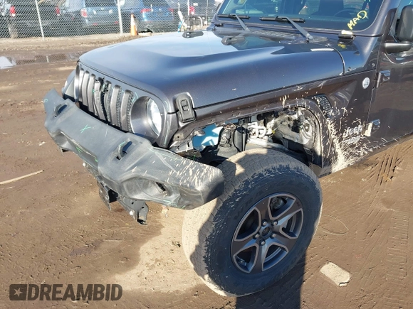 2018 Jeep Wrangler Unlimited Sport S with VIN 1C4HJXDN0JW255003, listed as a IAAI auction lot 41528394 with 55,660 mi miles and . Bid and sale history available at DreamBid. Image 6.
