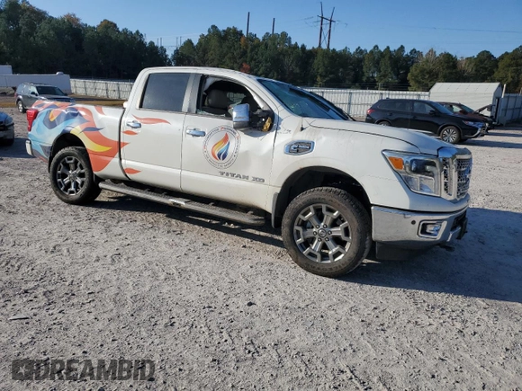 2019 Nissan Titan XD SL with VIN 1N6BA1F43KN511419, listed as a Copart auction lot 77875274 with 27,447 mi miles and Salvage Title. Bid and sale history available at carsss.com. Image 4.