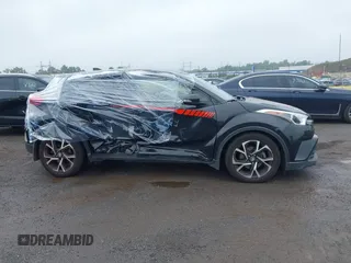 2018 Toyota C-HR XLE with VIN JTNKHMBX6J1000904, listed as a IAAI auction lot 42513117 with 77,192 mi miles and . Bid and sale history available at DreamBid. Image 13.