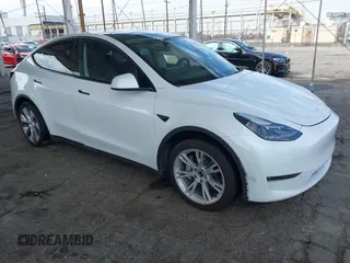 2023 Tesla Model Y Long Range with VIN 7SAYGAEE7PF607195, listed as a IAAI auction lot 41819147 with 74,694 mi miles. Bid and sale history available at carsss.com. Image 1.