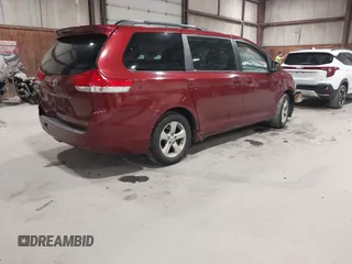 2013 Toyota Sienna LE AAS with VIN 5TDKK3DC6DS298372, listed as a IAAI auction lot 42062376 with 313,697 mi miles. Bid and sale history available at carsss.com. Image 4.