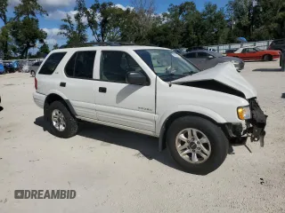 2002 Isuzu Rodeo S with VIN 4S2CK58W124322241, listed as a Copart auction lot 79009994 with 131,793 mi miles and Salvage Title. Bid and sale history available at DreamBid. Image 4.