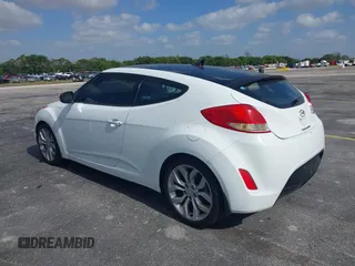 2013 Hyundai Veloster w/Gray Int with VIN KMHTC6AD0DU150516, listed as a IAAI auction lot 42164880 with 122,841 mi miles and . Bid and sale history available at DreamBid. Image 3.