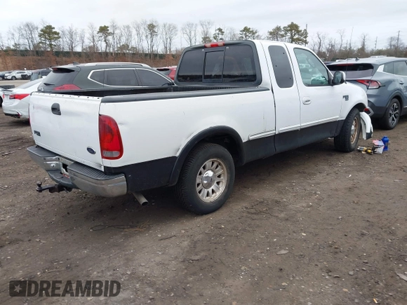2003 Ford F-150 XL with VIN 1FTRX17W73NA42322, listed as a IAAI auction lot 41680100 with 129,295 mi miles. Bid and sale history available at carsss.com. Image 4.