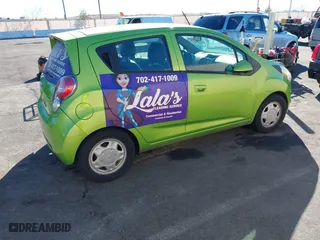 2014 Chevrolet Spark LS with VIN KL8CB6S98EC588931, listed as a IAAI auction lot 41690253 with 114,319 mi miles. Bid and sale history available at carsss.com. Image 4.