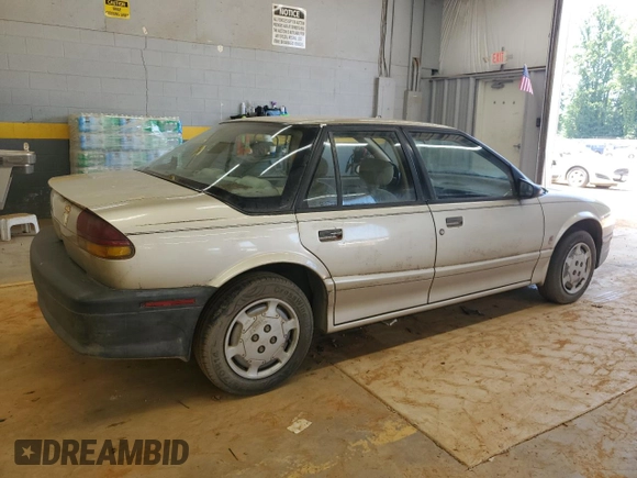 1995 Saturn SL with VIN 1G8ZH5280SZ302560, listed as a Copart auction lot 63290495 with 123,475 mi miles and Clean title. Bid and sale history available at DreamBid. Image 3.