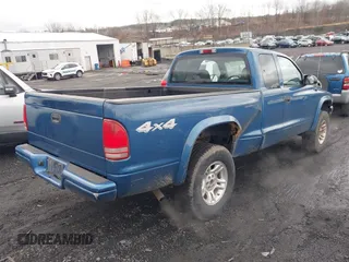 2003 Dodge Dakota Sport with VIN 1D7HG32NX3S322085, listed as a IAAI auction lot 41780125 with 95,321 mi miles. Bid and sale history available at carsss.com. Image 4.