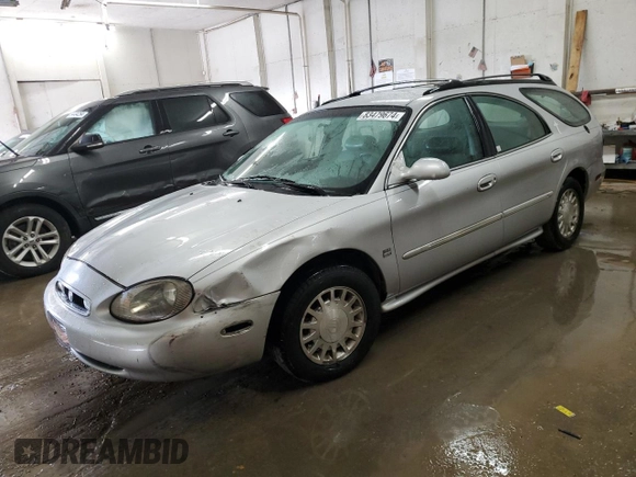 1999 Mercury Sable with VIN 1MEFM58S6XA647250, listed as a Copart auction lot 83479674 with 166,550 mi miles and Salvage title. Bid and sale history available at DreamBid. Image 1.