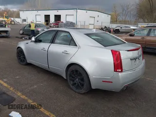 2009 Cadillac CTS AWD z VIN 1G6DH577X90135559, wystawiony jako IAAI lot #42077850 z przebiegiem 175 345 mil mil oraz . Historia ofert i sprzedaży dostępna na DreamBid. Obrazek 3.