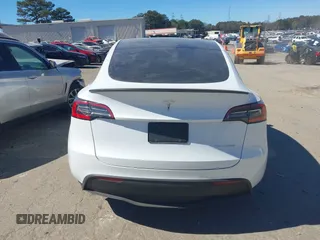 2021 Tesla Model Y Long Range with VIN 5YJYGDEE8MF125104, listed as a IAAI auction lot 41698065 with 25,177 mi miles and . Bid and sale history available at DreamBid. Image 15.
