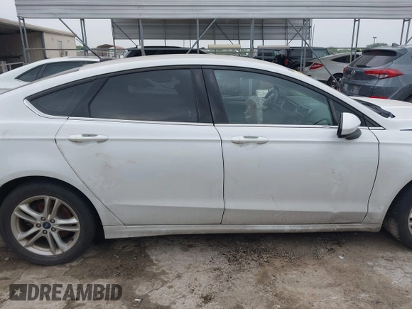 2018 Ford Fusion SE z VIN 3FA6P0HD1JR191576, wystawiony jako IAAI lot #42282669 z przebiegiem 73 439 mil mil oraz . Historia ofert i sprzedaży dostępna na DreamBid. Obrazek 13.