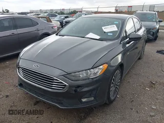 2020 Ford Fusion SE z VIN 3FA6P0HD5LR198744, wystawiony jako IAAI lot #42177820 z przebiegiem 97 520 mil mil oraz . Historia ofert i sprzedaży dostępna na DreamBid. Obrazek 2.