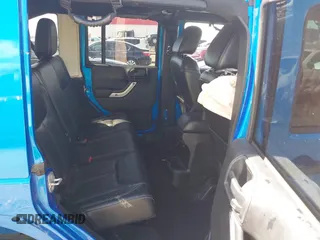 2015 Jeep Wrangler Unlimited Sahara z VIN 1C4HJWEG5FL650829, wystawiony jako IAAI lot #41824739 z przebiegiem 127 719 mil mil oraz . Historia ofert i sprzedaży dostępna na DreamBid. Obrazek 8.