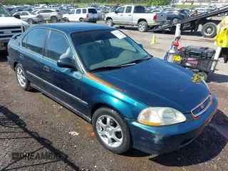 1997 Honda Civic LX with VIN 2HGEJ6676VH585410, listed as a IAAI auction lot 42015280 with 297,981 mi miles. Bid and sale history available at carsss.com. Image 1.