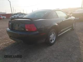 1999 Ford Mustang with VIN 1FAFP4047XF221818, listed as a IAAI auction lot 42261984 with 156,577 mi miles and . Bid and sale history available at DreamBid. Image 4.