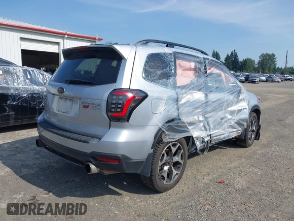 2015 Subaru Forester XT Touring with VIN JF2SJGWC1FH571301, listed as a IAAI auction lot 41682258 with 51,505 mi miles and . Bid and sale history available at DreamBid. Image 4.