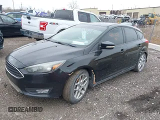 2015 Ford Focus SE with VIN 1FADP3K24FL302773, listed as a IAAI auction lot 41967128 with 202,193 mi miles. Bid and sale history available at carsss.com. Image 2.
