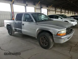 2002 Dodge Dakota SLT z VIN 1B7HL48N42S519724, wystawiony jako Copart lot #55533895 z przebiegiem 313 644 mil mil oraz Tytuł czysty. Historia ofert i sprzedaży dostępna na DreamBid. Obrazek 4.