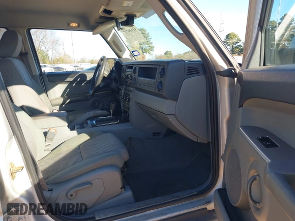 2007 Jeep Commander Sport z VIN 1J8HH48K77C587615, wystawiony jako IAAI lot #41149777 z przebiegiem 167 871 mil mil oraz . Historia ofert i sprzedaży dostępna na DreamBid. Obrazek 5.