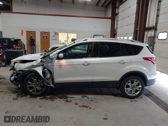 2014 Ford Escape Titanium with VIN 1FMCU9J91EUD43432, listed as a IAAI auction lot 40989177 with 110,383 mi miles and . Bid and sale history available at DreamBid. Image 14.