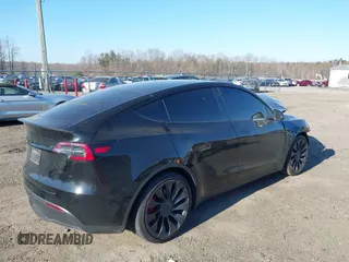 2022 Tesla Model Y Performance with VIN 7SAYGDEF0NF447460, listed as a IAAI auction lot 41670250 with 28,287 mi miles. Bid and sale history available at carsss.com. Image 4.