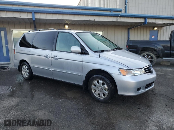 2003 Honda Odyssey EX-L with VIN 5FNRL18943B159553, listed as a Copart auction lot 72025294 with 182,942 mi miles and Salvage Title. Bid and sale history available at DreamBid. Image 4.