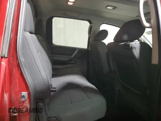 2014 Nissan Titan Pro-4X z VIN 1N6AA0EC6EN501437, wystawiony jako Copart lot #82822234 z przebiegiem 131 112 mil mil oraz Szkoda całkowita • Salvage title. Historia ofert i sprzedaży dostępna na DreamBid. Obrazek 10.