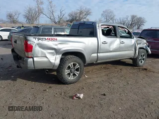 2017 Toyota Tacoma SR5 with VIN 3TMDZ5BN3HM025433, listed as a IAAI auction lot 41058797 with 68,355 mi miles and . Bid and sale history available at DreamBid. Image 4.