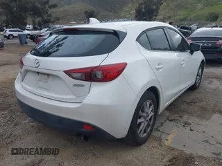 2014 Mazda 3 i Grand Touring with VIN JM1BM1M78E1208462, listed as a IAAI auction lot 41774218 with 82,781 mi miles and . Bid and sale history available at DreamBid. Image 4.